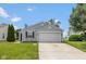 Charming single-story home featuring a two-car garage and a well-maintained front yard at 2080 Bridlewood Dr, Franklin, IN 46131