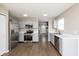 Spacious kitchen featuring stainless steel appliances, ample counter space, and wood-look flooring at 2080 Bridlewood Dr, Franklin, IN 46131