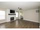 Inviting living room with a modern fireplace, recessed lighting, and durable flooring at 2080 Bridlewood Dr, Franklin, IN 46131