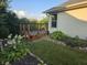 Backyard featuring a well-maintained deck, complemented by lush foliage and verdant green grass at 21 Watson Dr, Trafalgar, IN 46181