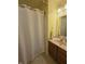 Bathroom with a tub and shower, a vanity with a sink, and tiled floors at 21 Watson Dr, Trafalgar, IN 46181