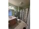 Functional bathroom featuring a wood vanity, a birch-themed shower curtain, and green-painted walls at 21 Watson Dr, Trafalgar, IN 46181