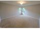 Large bedroom showcasing neutral walls, carpeting, and natural light coming from the windows at 21 Watson Dr, Trafalgar, IN 46181