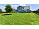 Expansive backyard featuring lush green lawn and mature tree, perfect for outdoor enjoyment at 21536 Gisborne Dr, Noblesville, IN 46062