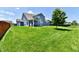 Spacious backyard featuring lush green lawn and mature tree, perfect for outdoor enjoyment at 21536 Gisborne Dr, Noblesville, IN 46062