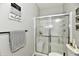Modern bathroom showcasing a glass shower, toilet, and towel rack with decorative towels at 21536 Gisborne Dr, Noblesville, IN 46062