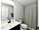 Clean bathroom features a vanity with a sink, toilet, and shower with curtain at 21536 Gisborne Dr, Noblesville, IN 46062
