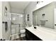 Modern bathroom featuring a glass-enclosed shower and sleek vanity, complete with stylish fixtures at 21536 Gisborne Dr, Noblesville, IN 46062