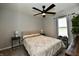 Cozy bedroom features a ceiling fan and natural light, creating a serene retreat at 21536 Gisborne Dr, Noblesville, IN 46062