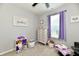 Bright bedroom features a plush carpet, ample natural light, and charming decor at 21536 Gisborne Dr, Noblesville, IN 46062