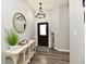 Welcoming entryway with decorative accents and modern lighting at 21536 Gisborne Dr, Noblesville, IN 46062