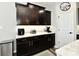 Kitchen featuring dark cabinets, white countertops, and modern appliances for easy meal preparation at 21536 Gisborne Dr, Noblesville, IN 46062