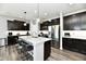 Modern kitchen with stainless steel appliances, dark cabinets, and a granite-topped island at 21536 Gisborne Dr, Noblesville, IN 46062