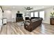 Comfortable living room featuring a leather sectional and fireplace at 21536 Gisborne Dr, Noblesville, IN 46062