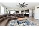 Inviting living room with open layout and modern ceiling fan at 21536 Gisborne Dr, Noblesville, IN 46062