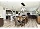 Open concept living space with kitchen, dining area, and living room at 21536 Gisborne Dr, Noblesville, IN 46062