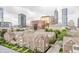 An aerial view of urban townhomes with downtown city skyline in the background at 225 N New Jersey St # 52, Indianapolis, IN 46204