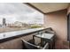 Relaxing condo balcony with seating and views of the surrounding cityscape at 225 N New Jersey St # 52, Indianapolis, IN 46204