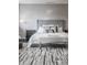 Chic bedroom with stylish furniture, patterned rug, and modern decor at 225 N New Jersey St # 52, Indianapolis, IN 46204