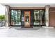 Welcoming entrance to the building with floor to ceiling windows and metal pillars at 225 N New Jersey St # 52, Indianapolis, IN 46204