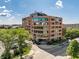 Stunning exterior view of building with blue tinted windows on a sunny day at 225 N New Jersey St # 52, Indianapolis, IN 46204