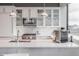 Gourmet kitchen with stainless steel appliances, white cabinetry and marble backsplash at 225 N New Jersey St # 52, Indianapolis, IN 46204