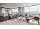 Bright living room with stylish furniture, hardwood floors, and modern kitchen at 225 N New Jersey St # 52, Indianapolis, IN 46204