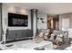 Contemporary living space showcasing sleek cabinetry, comfortable seating, and a modern entertainment setup at 225 N New Jersey St # 52, Indianapolis, IN 46204