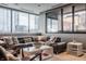 Comfortable living room with city views, a plush sectional, and stylish coffee table decor at 225 N New Jersey St # 52, Indianapolis, IN 46204