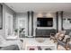 Open-concept living space with modern decor, stylish furnishings, and hardwood floors throughout at 225 N New Jersey St # 52, Indianapolis, IN 46204