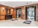 Lobby area featuring elevator access, wood trim, and tile flooring at 225 N New Jersey St # 52, Indianapolis, IN 46204