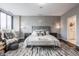 Luxurious main bedroom with stylish decor, a comfortable bed and neutral colors at 225 N New Jersey St # 52, Indianapolis, IN 46204