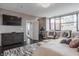 Bright main bedroom with hardwood floors, and comfortable sitting area with nice city views at 225 N New Jersey St # 52, Indianapolis, IN 46204