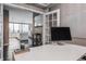 Stylish home office with modern desk, decor, and view into the kitchen area at 225 N New Jersey St # 52, Indianapolis, IN 46204