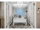 Cozy home office featuring a white desk, chandelier lighting, and an accent painting at 225 N New Jersey St # 52, Indianapolis, IN 46204
