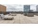 Rooftop deck with lounge chairs and city views showcasing an ideal outdoor living space at 225 N New Jersey St # 52, Indianapolis, IN 46204