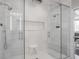 Glass enclosed shower with dual shower heads and marble tile at 225 N New Jersey St # 52, Indianapolis, IN 46204