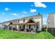 Large backyard with a covered patio area, perfect for outdoor entertaining and relaxation at 2282 Creekland Dr, Columbus, IN 47201