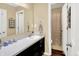 Inviting bathroom featuring a wide mirror and a vanity, creating a functional and aesthetically pleasing space at 2282 Creekland Dr, Columbus, IN 47201