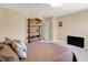 Comfortable bedroom featuring a brown patterned quilt and a rustic wooden shelving unit at 2282 Creekland Dr, Columbus, IN 47201
