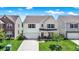 Charming two-story home with a well-manicured lawn, covered porch, and attached garage at 2282 Creekland Dr, Columbus, IN 47201