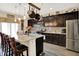 Modern kitchen with a spacious island, stylish lighting, and stainless steel appliances at 2282 Creekland Dr, Columbus, IN 47201
