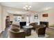 Bright living area with a barrel table, neutral walls, and wood-look flooring at 2282 Creekland Dr, Columbus, IN 47201