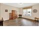 Bright living area with modern floors, natural light from a large window, and classic wooden furnishings at 2282 Creekland Dr, Columbus, IN 47201