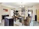 Cozy living space features modern flooring, comfortable seating, and access to a staircase and other rooms at 2282 Creekland Dr, Columbus, IN 47201
