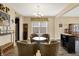 Charming living space with a wine rack, cozy chairs, and a unique barrel table at 2282 Creekland Dr, Columbus, IN 47201