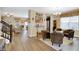 Open-concept living area with cozy seating, chandelier, and wine rack at 2282 Creekland Dr, Columbus, IN 47201