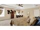 A spacious main bedroom with a tray ceiling, carpet, dresser, and decoratively arranged hats at 2282 Creekland Dr, Columbus, IN 47201