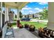 Inviting porch with comfortable seating, vibrant floral arrangements, and a view of the neighborhood street at 2282 Creekland Dr, Columbus, IN 47201