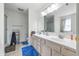 Bathroom featuring a double vanity, large mirror and ample counter space at 2463 Kettering Way, Indianapolis, IN 46214